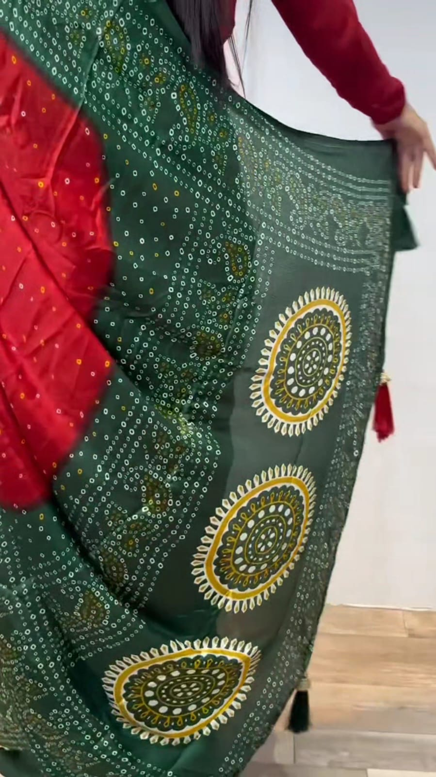 RED AND GREEN BANDHNI SAREE.